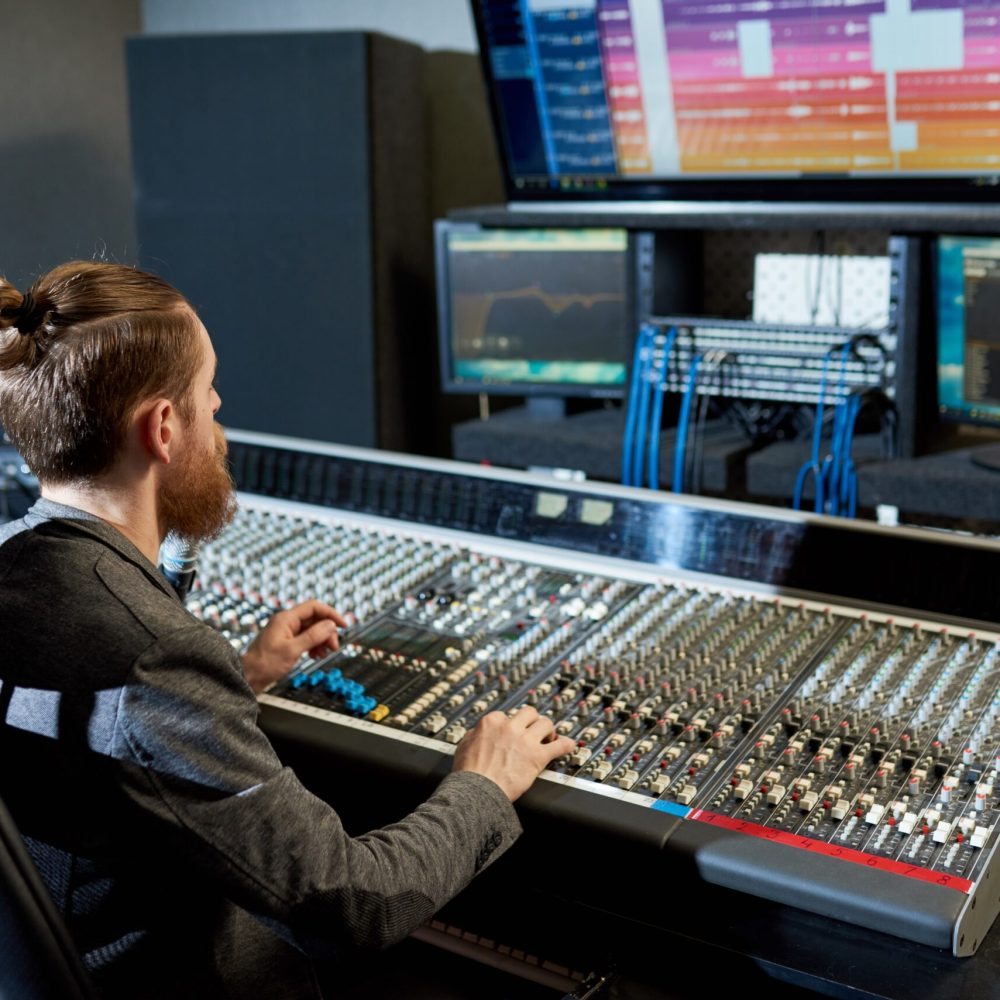 man-mixing-and-creating-music-2025-03-09-20-07-15-utc-min-1-scaled